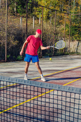 tennis player hit the ball