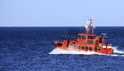 pilot boat orange tugboat at the sea
