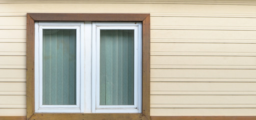 White wooden windows on stack wooden wall