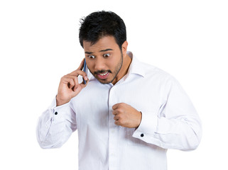 Business man having unpleasant conversation on a phone