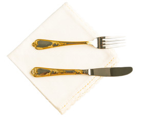 Dinner napkin with fork and knife over white background