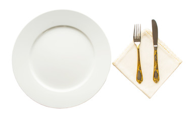 Empty plate with fork, knife and napkin on white background