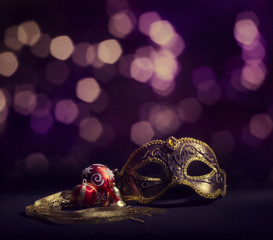 Carnival mask on a background of holiday lights.