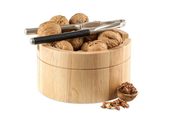 Walnuts in utensil with nutcracker