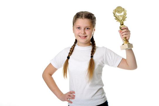 Proud young girl holding her trophy