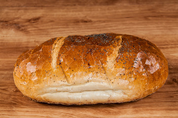 fresh bread on the brown wooden table