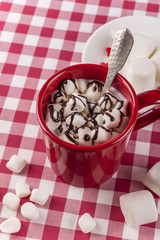 Hot chocolate and marshmallows in red cup