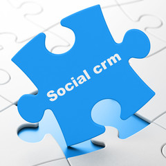 Business concept: Social CRM on puzzle background