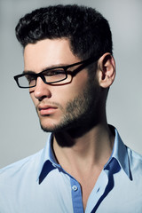 Handsome man wearing fashion eyeglasses