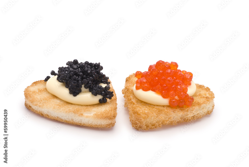 Wall mural Two Heart-Shaped Toasts with Red and Black Caviar on White Sauce