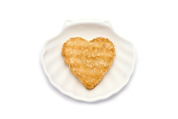 Heart-Shaped Toast on Shell Dish isolated on white