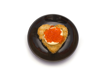 Small Plate with Heart-Shaped Toast with Red Caviar on White Sau