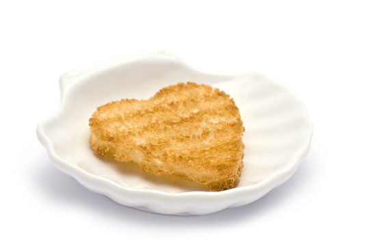 Heart-Shaped Toast on Shell Dish isolated on white