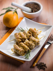 skewer rolled up with clove and orange juice, selective focus