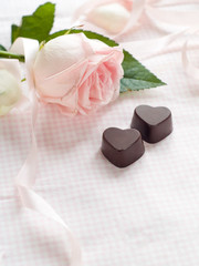 Pink rose with chocolate candy