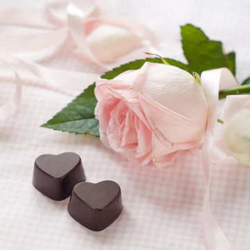 Pink rose with chocolate candy