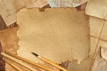 Bamboo pen on background of an old grange paper
