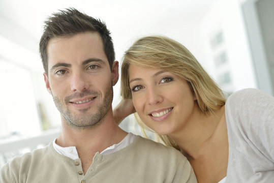 Portrait of young couple relaxing at home