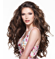 Beautiful adult woman with long brown curly hair.