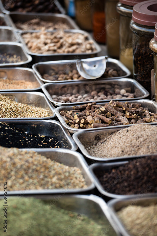 Wall mural Indian colored spices at local market.