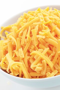 grated cheddar cheese in bowl
