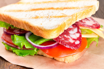 Sandwich with sausage and tomato