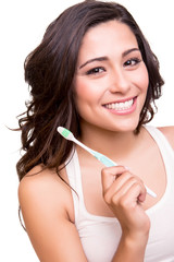 Woman holding a tooth brush