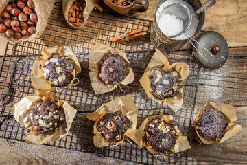 Vanilla muffins with powder sugar on colling rack