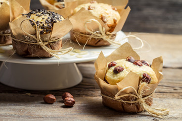 Vanilla muffin with nuts wrapped in paper