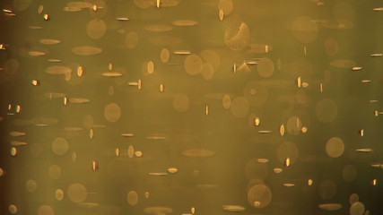 Golden abstract background: gas bubbles in beer