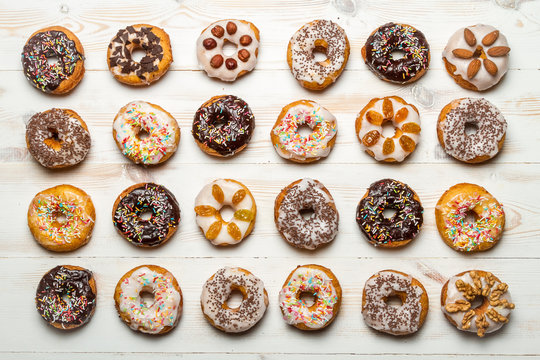 Large group of colorfully decorated donuts