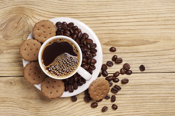 Cup of hot coffee and chocolate cookies