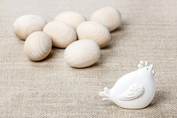 Ceramic hen and easter eggs on the table
