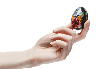 Easter egg in beautiful hand isolated on white