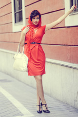 Beautiful woman in urban background. Vintage style