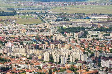 Obraz premium Wide aerial view of residential suburbs of Brasov city, Romania