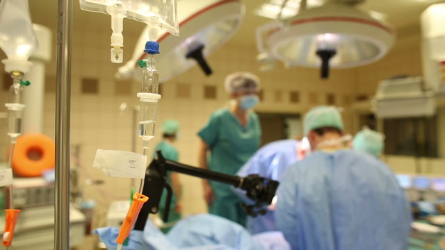 Team of surgeons performing an operation