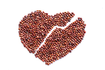 Heart of red beans on a white background