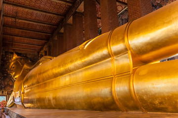 Fototapeta premium Golden big Buddha face in Wat Pho , Bangkok , Thailand. Grand Pa