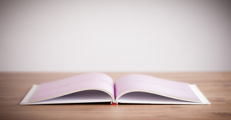 Open book on wooden deck