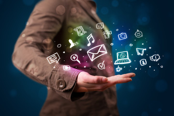 Young woman presenting colorful social media icons