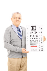 Senior man holding eyesight test