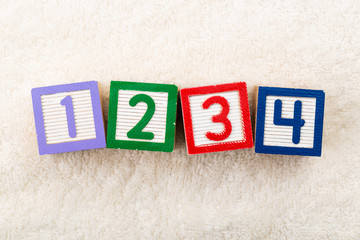 1234 toy block with towel background