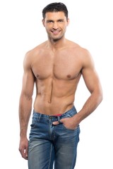Fototapeta premium Handsome young man in blue jeans with naked torso
