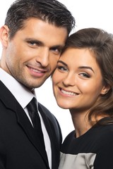 Beautiful young couple in suit and dress 
