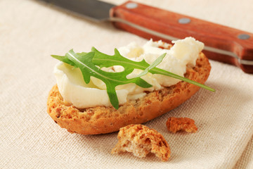 Crisp roll with cheese spread