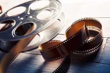 dramatic lit image of a movie reel © fergregory