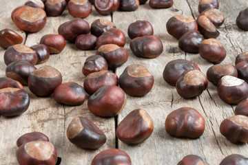 Closeup chestnuts on wooden desk