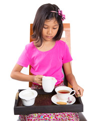 Young Asian girl with a tray of a cup of tea, sugar and milk