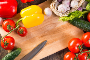 Vegetables tiled around a sheet of paper